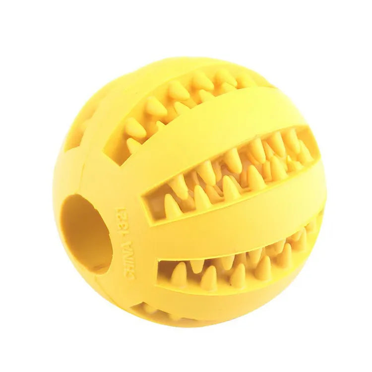 Yellow rubber ball with textured surface on a white background