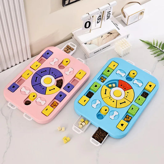 Two colorful puzzle toys on a light surface with a calendar and plant in the background.