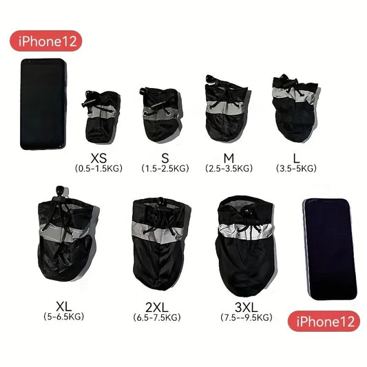 Set of black pet carriers with size labels and an iPhone 12 phone for scale on a white background.
