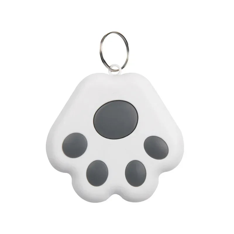 White paw-shaped keychain with black spots on a white background