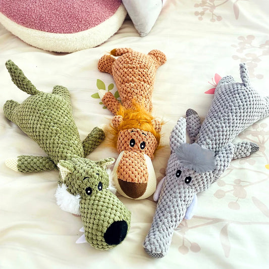 Three crocheted animal toys on a soft surface