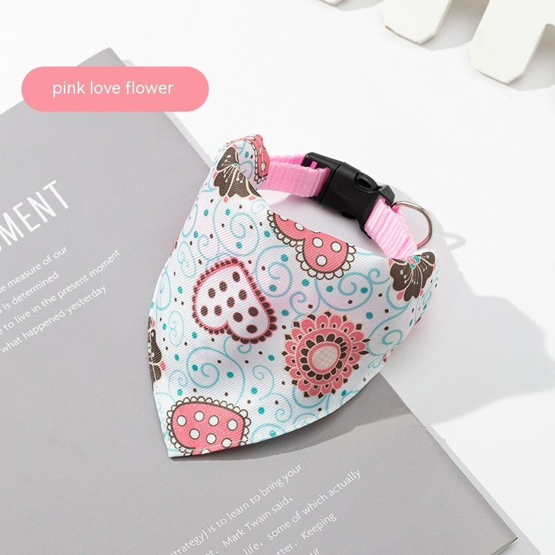 Floral patterned bandana with pink love flower design on a white surface