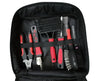 Pet grooming tool set with black and red tools and a glove in an open case on a white background.