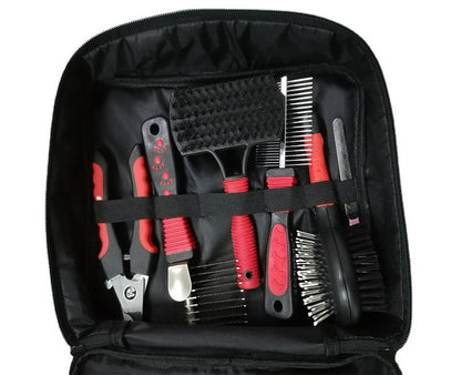 Pet grooming tool set with black and red tools and a glove in an open case on a white background.