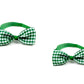 Two green and white checkered bow ties on a white background