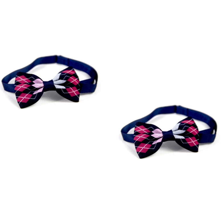 Two dog bow ties with argyle pattern on a white background