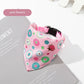 Pink floral-patterned dog bandana on a magazine with 'pink flowers' label.