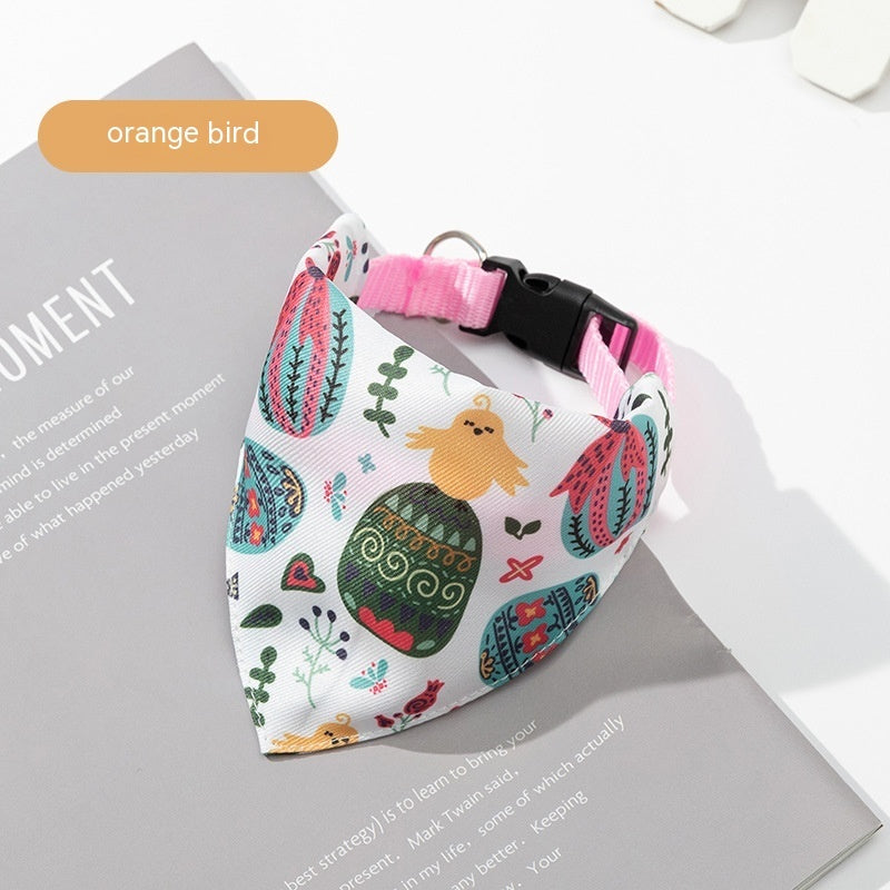 Colorful dog bandana with a pink collar on a magazine