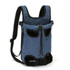 A collection of soft pet carriers in various colors and patterns, designed to be worn on the back for transporting pets.