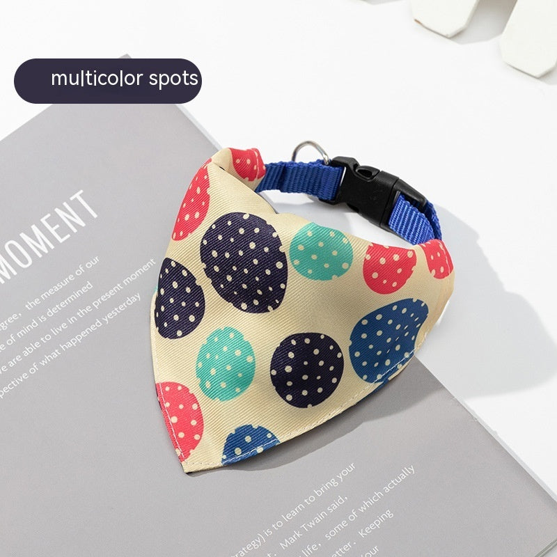 Dog bandana with multicolor spots on a magazine