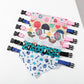 Set of colorful pet collars with various patterns on a white background