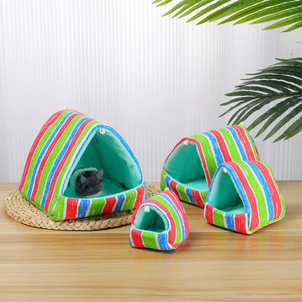 Colorful striped pet house on a wooden surface with a white background