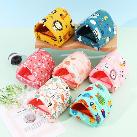 Colorful pet houses with animal patterns on a light green background