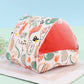Pet bed with dinosaur pattern on a light blue background