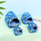 Set of blue children's slides with animal pattern on a light green surface.