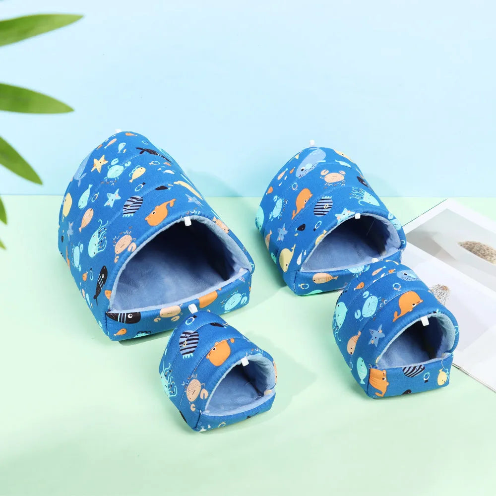 Set of blue children's slides with animal pattern on a light green surface.
