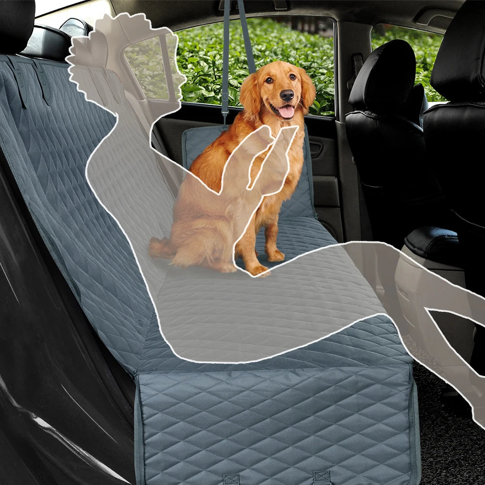 Dog sitting on a car seat cover in a vehicle with a green field outside.