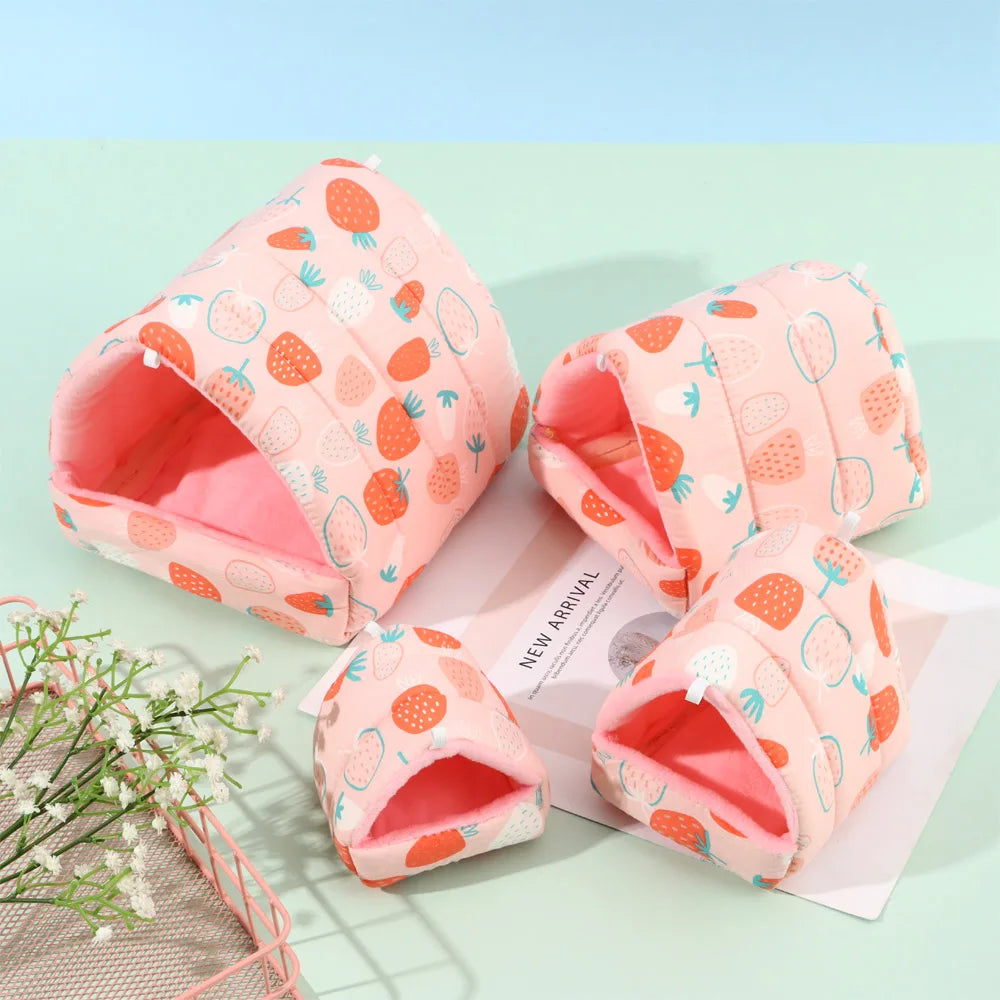 Pink slippers with strawberry pattern on a light green background