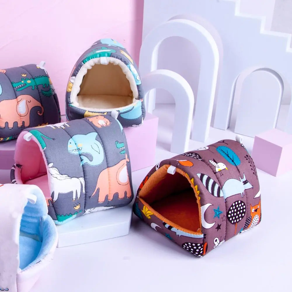 Children's tunnel toys with animal prints on a white surface