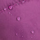 Close-up of a purple fabric with water droplets demonstrating water resistance.