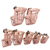 Set of pink pet muzzles with a lattice design on a white background