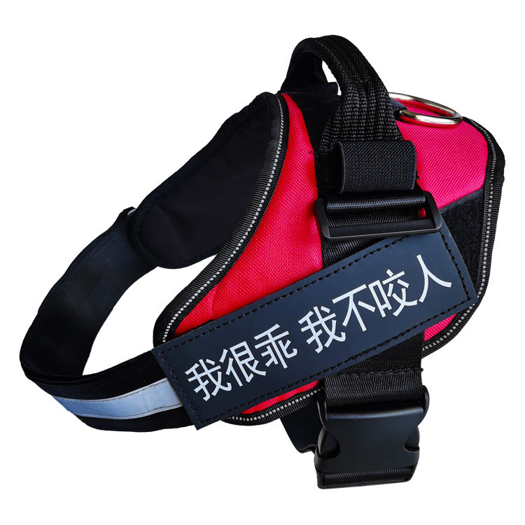 Red and black dog harness with a reflective patch on a white background