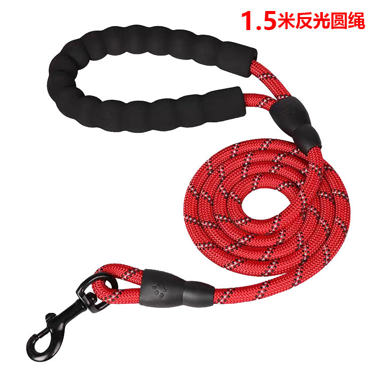 Red dog leash with black handle and clip on a white background