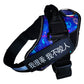 Dog harness with colorful pattern and black strap displaying text on a white background