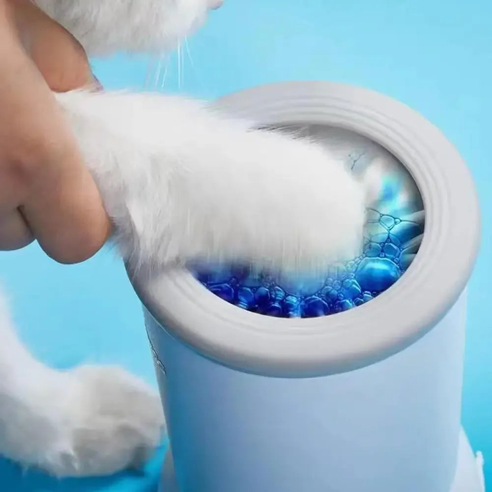 Person cleaning a pet's litter box with a white cloth against a blue background