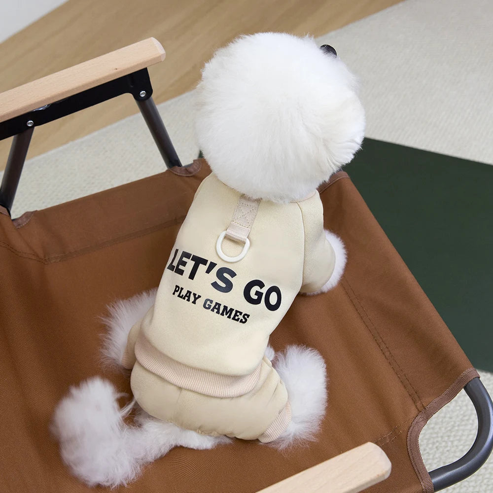 Dog toy with 'Let's Go Play Games' text on a chair