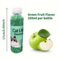 Cat litter deodorizer bottle with green fruit flavor next to a green apple on a white background