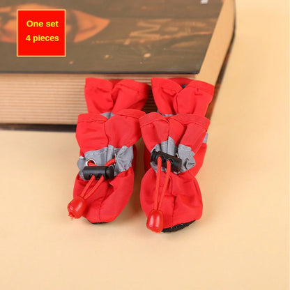 Red pet boots with gray accents on a beige surface, labeled as one set of four pieces.