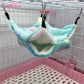 Pet hammock hanging inside a cage with pink base