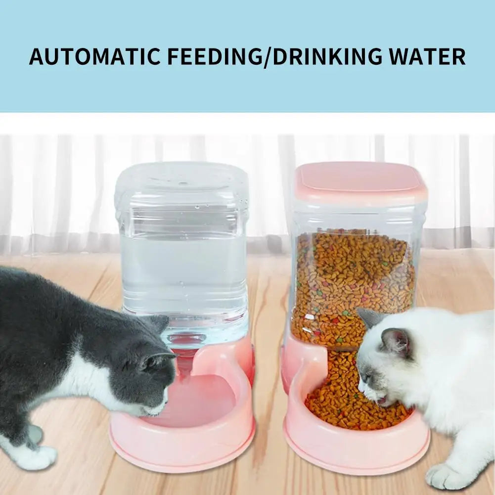 Two cats using an automatic pet feeder and water dispenser on a wooden floor.