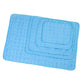 Set of blue bath mats with textured surface on a white background