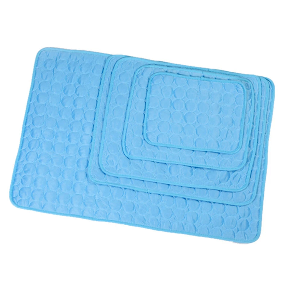 Set of blue bath mats with textured surface on a white background