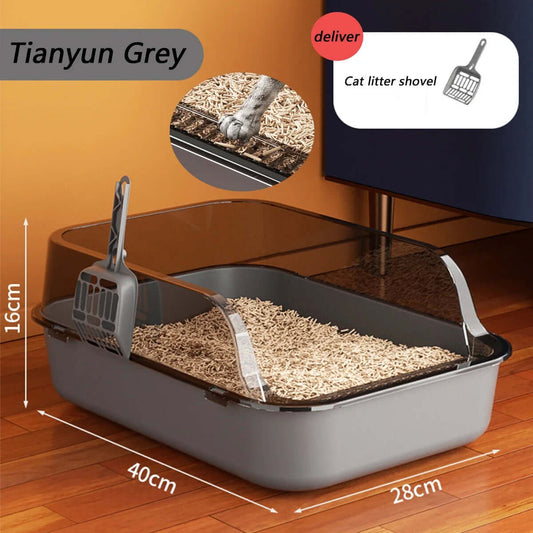 Cat litter box with scoop on a wooden floor, featuring dimensions and a deliver logo.