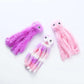 Three plush octopus toys in pink, purple, and white on a white background