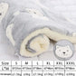 Fluffy white and gray blanket with a bear design and size chart on a light gray background