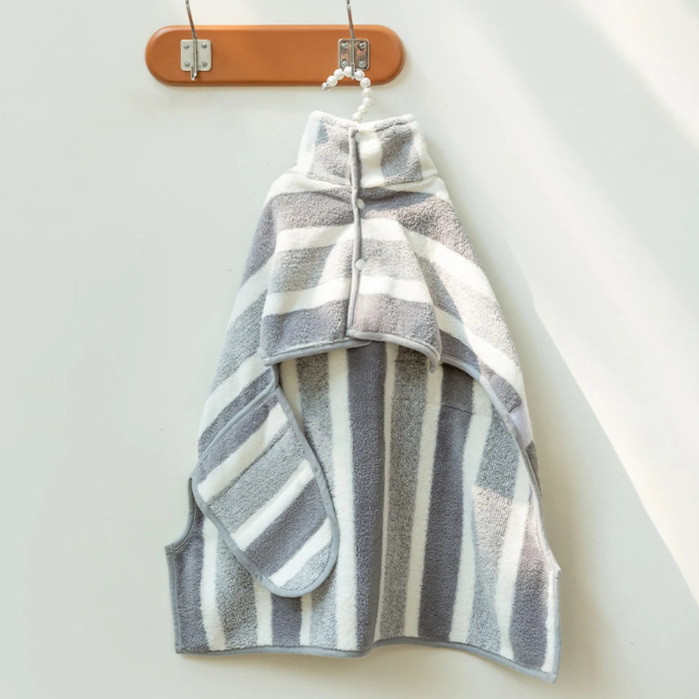 Striped towel hanging on a wooden hanger against a white background