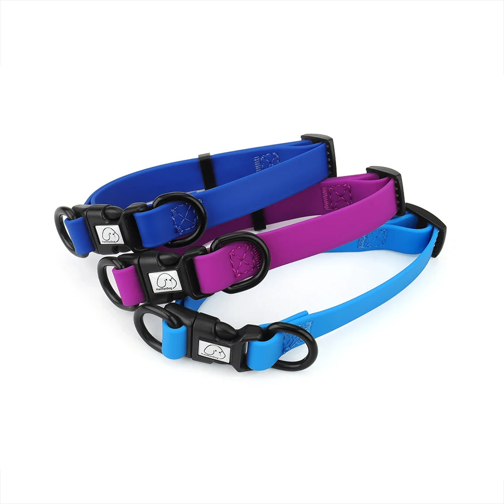 Three dog collars in blue, purple, and black on a white background