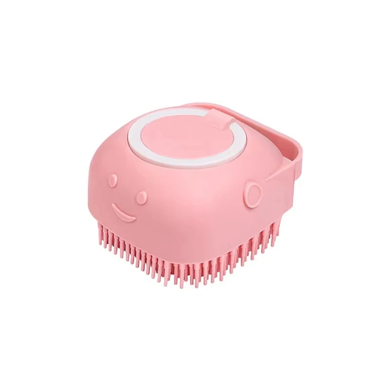 Pink scalp massager with a smiley face design on a white background