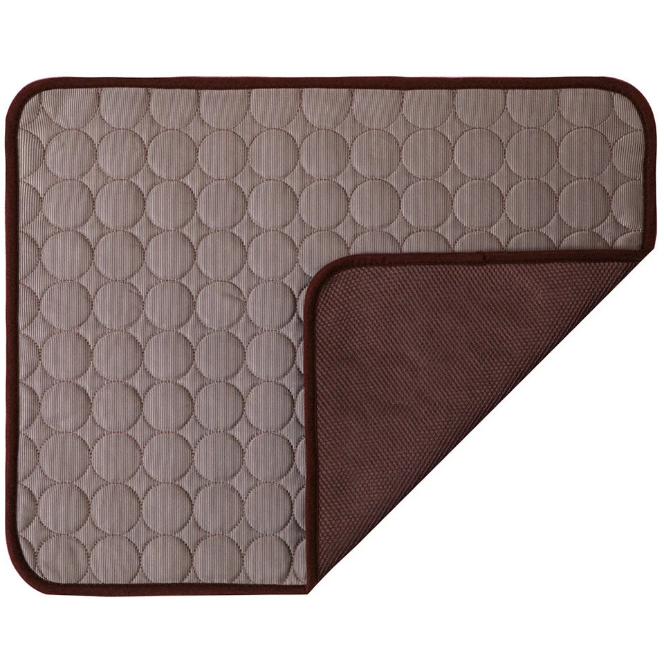 Two textured mats, one beige with circular pattern and one brown, on a white background.