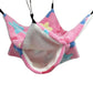 Pink pet hammock with colorful patterns on a white background
