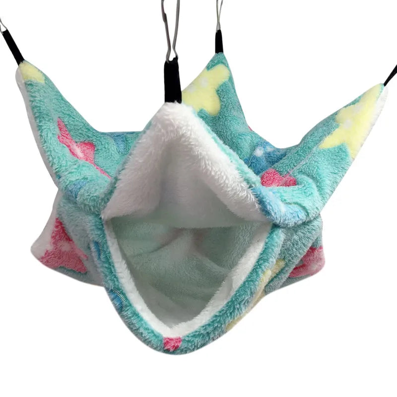 Plush pet hammock with colorful design on a white background