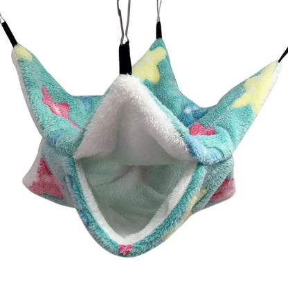 Plush pet hammock with colorful design on a white background