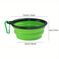 Green collapsible dog bowl with measurements on a white background