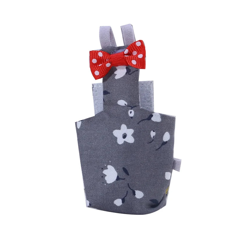 Gray apron with floral pattern and red bow on a white background