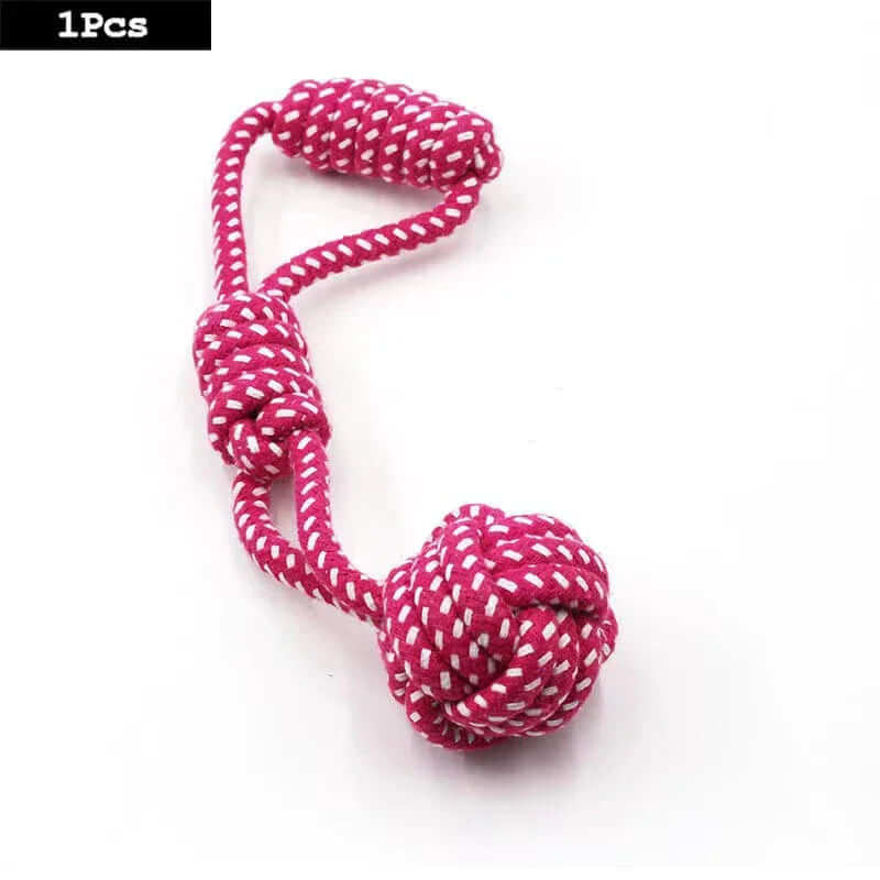Pink and white rope toy on a white background