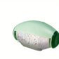 Green pet toy with crumbly interior on a white background